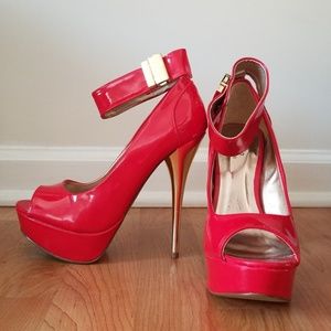 Brand new. Red /gold patent peep toe heels